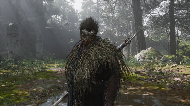 The player character in Wukong looks terrifying and powerful in a forest clearing.